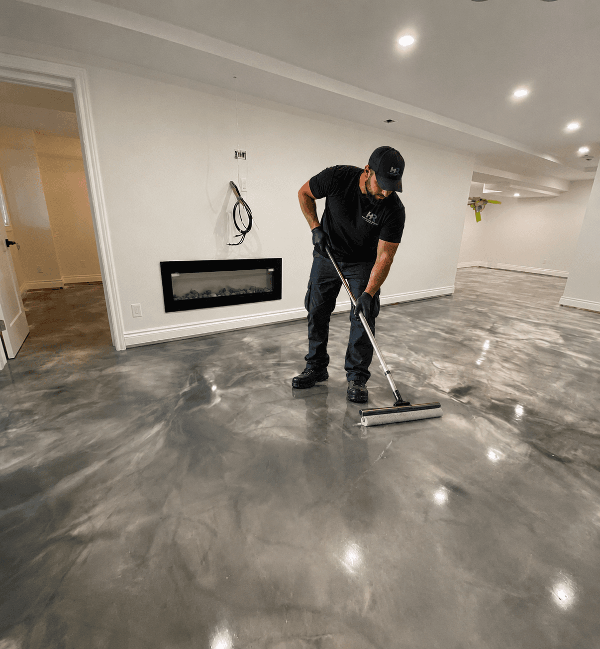 Hampton Roads Epoxy technician applying a metallic epoxy floor coating